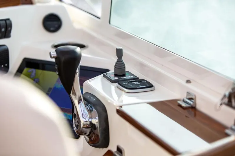 Given To Fly Yacht Photos Pics Control panel of 2021 Hunt Yachts Harrier 26, featuring joystick and throttle.