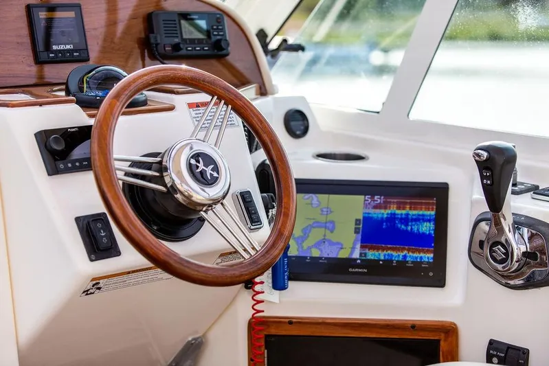 Given To Fly Yacht Photos Pics 2021 Hunt Yachts Harrier 26 helm with Garmin display and Suzuki controls.