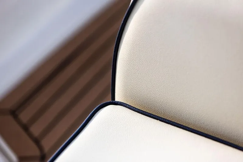 Given To Fly Yacht Photos Pics Close-up of 2021 Hunt Yachts Harrier 26 beige leather seat with dark trim.