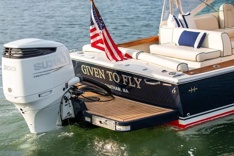 Given To Fly Yacht Photos Pics 2021 Hunt Yachts Harrier 26 with Suzuki engine, American flag, and luxury seating.