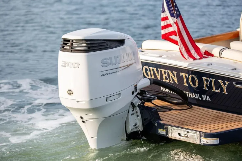 Given To Fly Yacht Photos Pics 2021 Hunt Yachts Harrier 26 with Suzuki 300 engine, American flag, "Given to Fly" text.