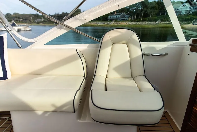 Given To Fly Yacht Photos Pics Luxury seating on 2021 Hunt Yachts Harrier 26, featuring elegant cream upholstery.