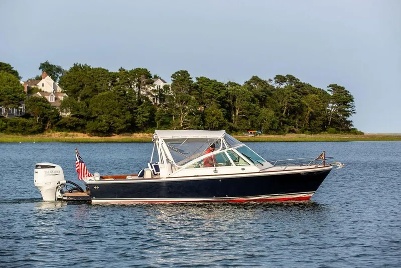 Given To Fly Yacht Photos Pics 2021 Hunt Yachts Harrier 26 on calm water with scenic background.