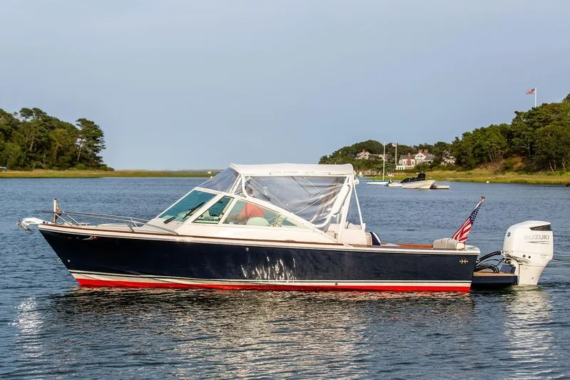 Given To Fly Yacht Photos Pics 2021 Hunt Yachts Harrier 26 boat on calm water with scenic background.