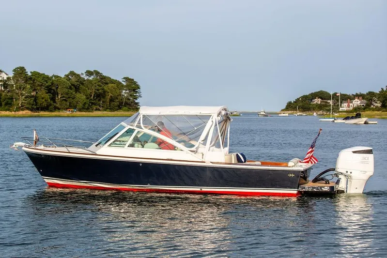 Given To Fly Yacht Photos Pics 2021 Hunt Yachts Harrier 26 boat on calm water with scenic background.