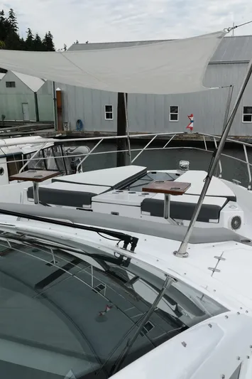  Yacht Photos Pics 2021 Cruisers Yachts 60 Cantius docked, featuring sleek design and spacious deck.