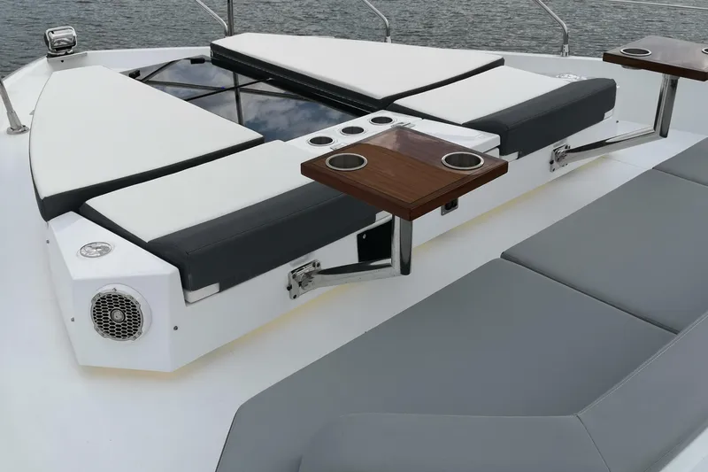  Yacht Photos Pics Luxury sunbathing area on 2021 Cruisers Yachts 60 Cantius with cushioned seating and cup holders.