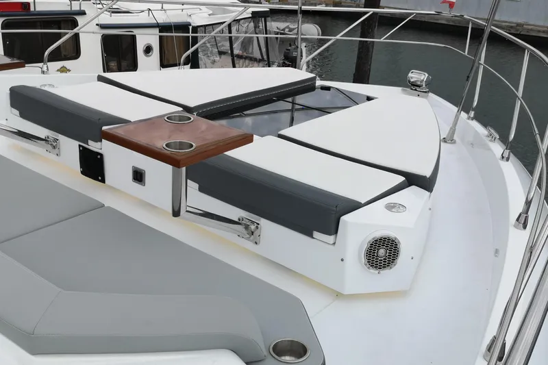  Yacht Photos Pics 2021 Cruisers Yachts 60 Cantius deck with cushioned seating and cup holders.