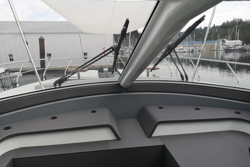  Yacht Photos Pics 2021 Cruisers Yachts 60 Cantius interior view with sleek design and marina backdrop.