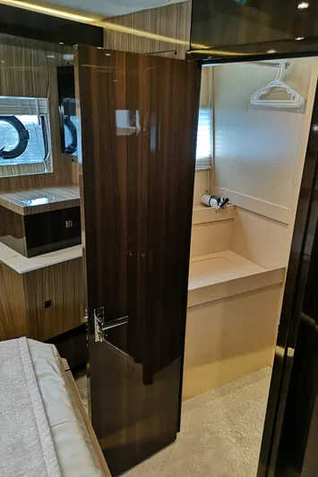  Yacht Photos Pics Interior of 2021 Cruisers Yachts 60 Cantius, featuring a sleek bathroom and modern design.