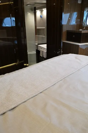  Yacht Photos Pics Luxurious interior of 2021 Cruisers Yachts 60 Cantius, featuring elegant bedroom and bathroom.