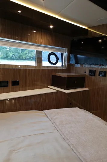  Yacht Photos Pics Interior of 2021 Cruisers Yachts 60 Cantius with modern wood finish and window view.