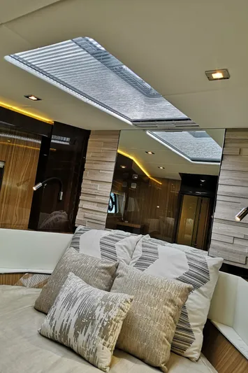  Yacht Photos Pics Interior of 2021 Cruisers Yachts 60 Cantius with skylight and plush cushions.