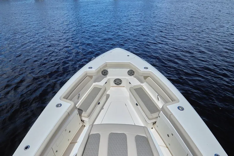 Tropical Moon Yacht Photos Pics 2022 Solace 41 CS boat bow with seating, on calm water.