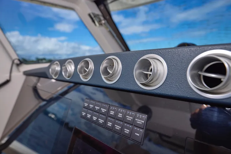 Tropical Moon Yacht Photos Pics Dashboard of 2022 Solace 41 CS boat with air vents and control panel.