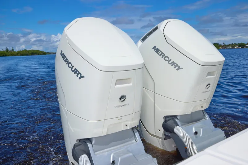 Tropical Moon Yacht Photos Pics Twin Mercury outboard engines on a 2022 Solace 41 CS boat, cruising on a sunny day.