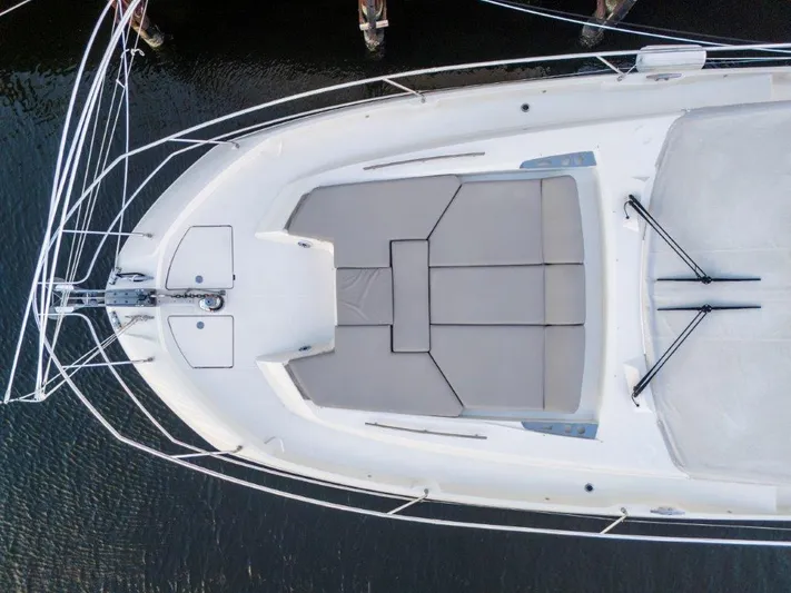 59' 2020 Prestige 590 Flybridge Yacht Photos Pics Aerial view of 2020 Prestige 590 flybridge yacht's deck with cushioned seating.
