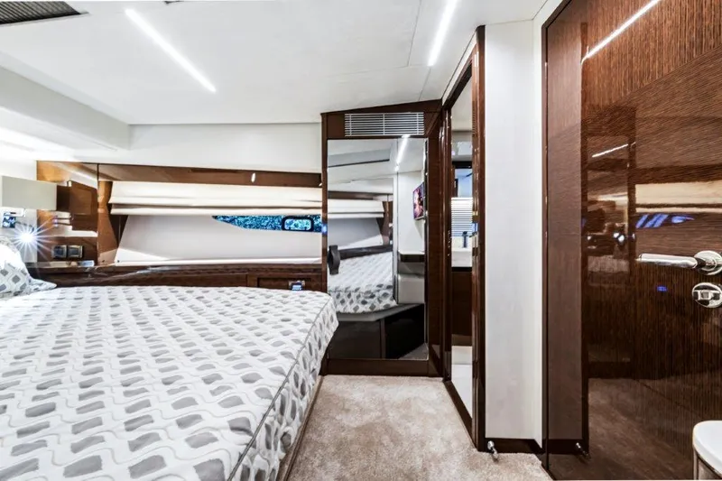 59' 2020 Prestige 590 Flybridge Yacht Photos Pics Luxurious bedroom interior of 2020 Prestige 590 Flybridge yacht with modern design and elegant finishes.