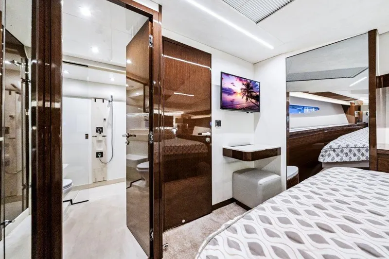 59' 2020 Prestige 590 Flybridge Yacht Photos Pics Luxurious interior of 2020 Prestige 590 flybridge yacht with modern bedroom and ensuite bathroom.