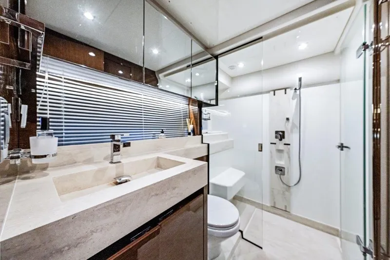 59' 2020 Prestige 590 Flybridge Yacht Photos Pics Luxurious bathroom on 2020 Prestige 590 Flybridge yacht, featuring modern fixtures and elegant design.