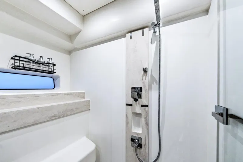 59' 2020 Prestige 590 Flybridge Yacht Photos Pics Modern shower area in 2020 Prestige 590 Flybridge yacht bathroom.