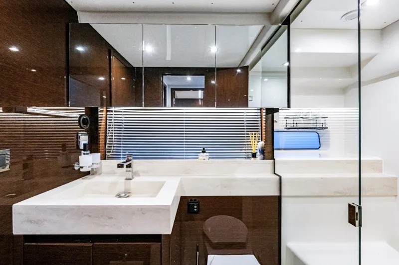 59' 2020 Prestige 590 Flybridge Yacht Photos Pics Luxurious bathroom interior of 2020 Prestige 590 Flybridge yacht with modern fixtures and sleek design.