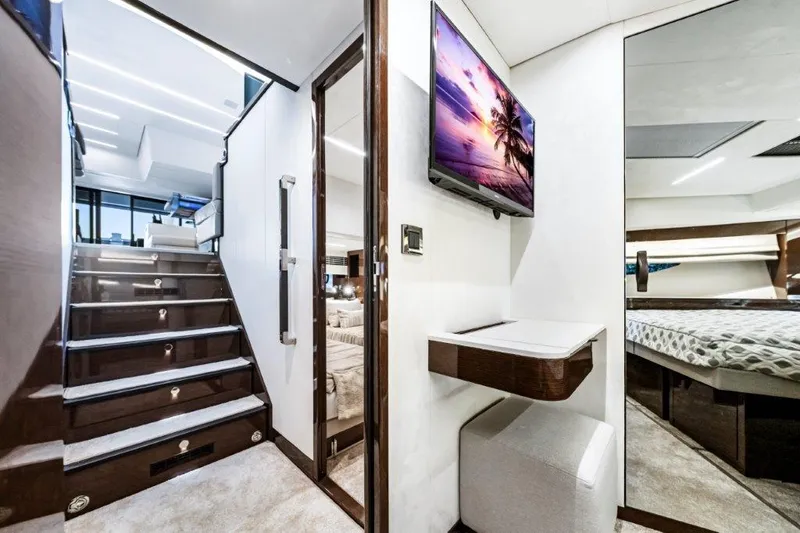 59' 2020 Prestige 590 Flybridge Yacht Photos Pics Luxurious interior of 2020 Prestige 590 flybridge yacht with modern decor and elegant staircase.