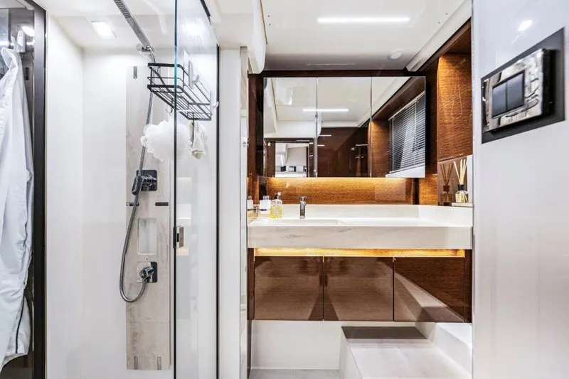 59' 2020 Prestige 590 Flybridge Yacht Photos Pics Luxurious bathroom interior of 2020 Prestige 590 flybridge yacht with modern fixtures and elegant design.