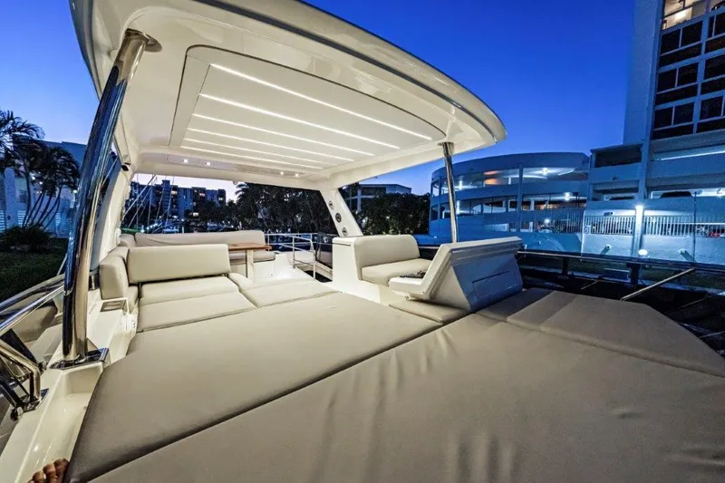 59' 2020 Prestige 590 Flybridge Yacht Photos Pics Luxurious 2020 Prestige 590 flybridge yacht with spacious seating at dusk.