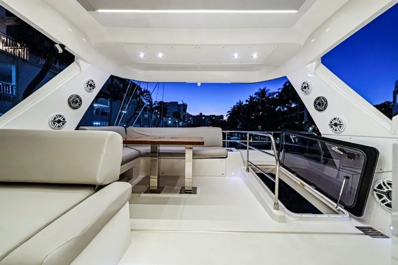 59' 2020 Prestige 590 Flybridge Yacht Photos Pics Luxurious 2020 Prestige 590 flybridge yacht interior with elegant seating and ambient lighting.