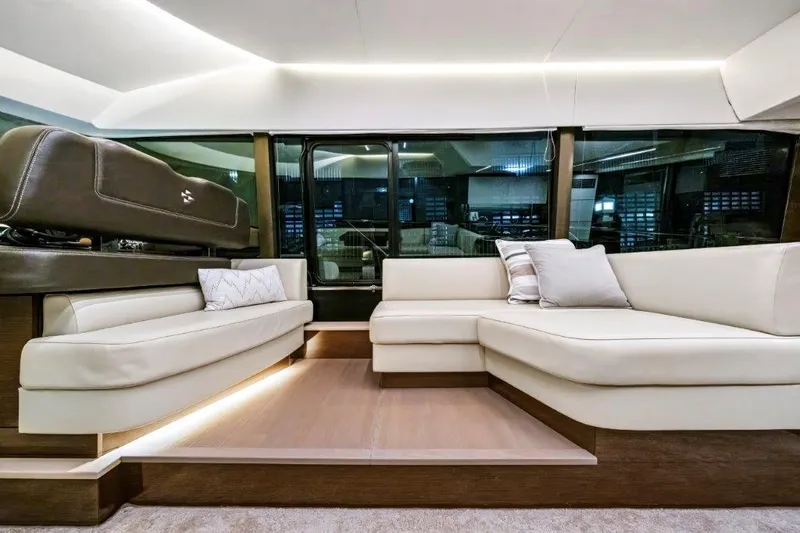 59' 2020 Prestige 590 Flybridge Yacht Photos Pics Luxurious interior of 2020 Prestige 590 flybridge yacht with elegant seating and modern design.