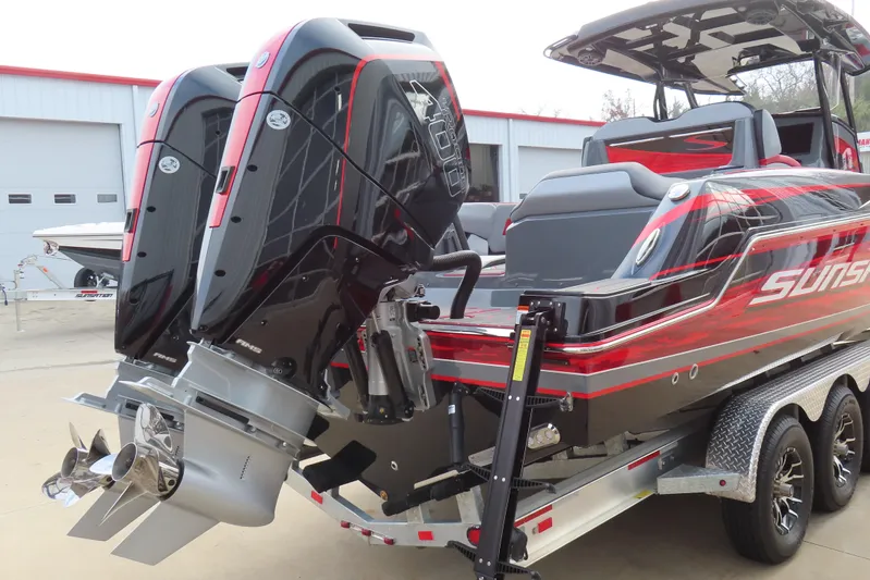  Yacht Photos Pics 2025 Sunsation 32 CCX boat with dual outboard engines on a trailer.