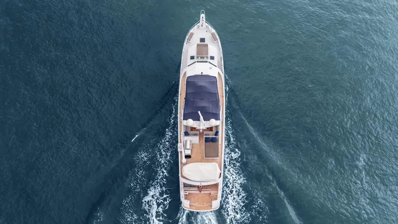  Yacht Photos Pics Aerial view of 1998 Hatteras 74 Sport Deck Motor Yacht cruising on open water.