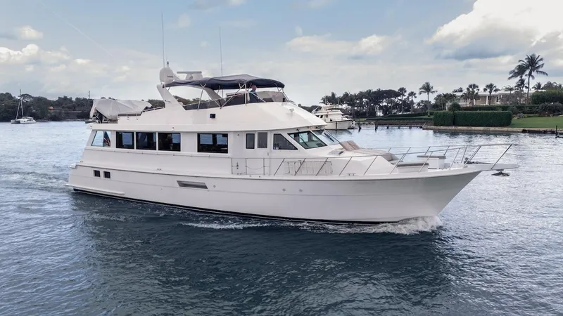  Yacht Photos Pics 1998 Hatteras 74 Sport Deck Motor Yacht cruising on calm waters.