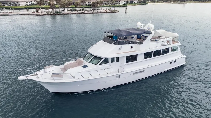  Yacht Photos Pics 1998 Hatteras 74 Sport Deck Motor Yacht cruising on calm waters.