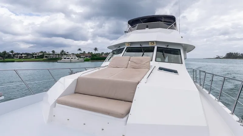  Yacht Photos Pics 1998 Hatteras 74 Sport Deck Motor Yacht on water, featuring spacious deck and seating.