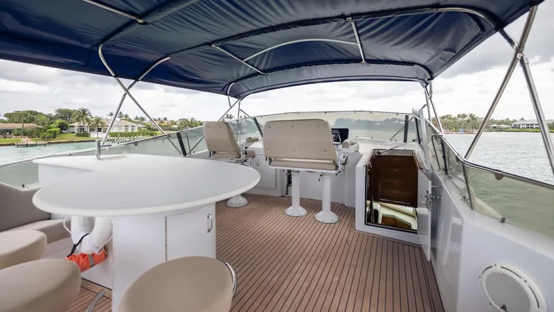  Yacht Photos Pics 1998 Hatteras 74 Sport Deck Motor Yacht with spacious upper deck and seating area.