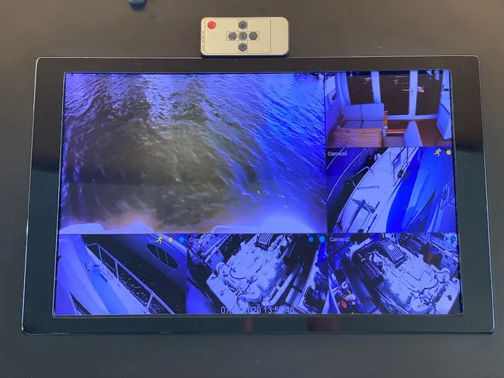  Yacht Photos Pics Security monitor displaying multiple camera views on a 1998 Hatteras 74 Sport Deck Motor Yacht.