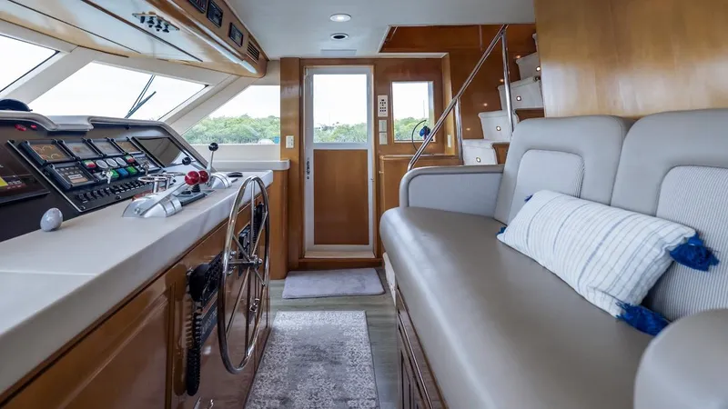  Yacht Photos Pics Interior of 1998 Hatteras 74 Sport Deck Motor Yacht with helm and seating area.