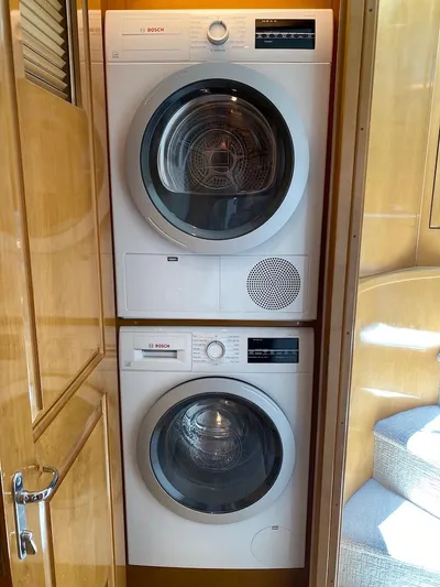  Yacht Photos Pics Stacked Bosch washer and dryer inside 1998 Hatteras 74 Sport Deck Motor Yacht.