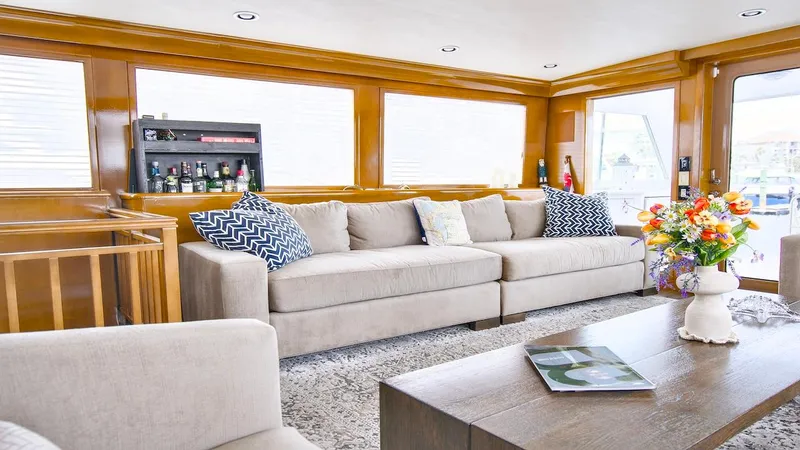  Yacht Photos Pics Luxurious interior of 1998 Hatteras 74 Sport Deck Motor Yacht with elegant seating and decor.