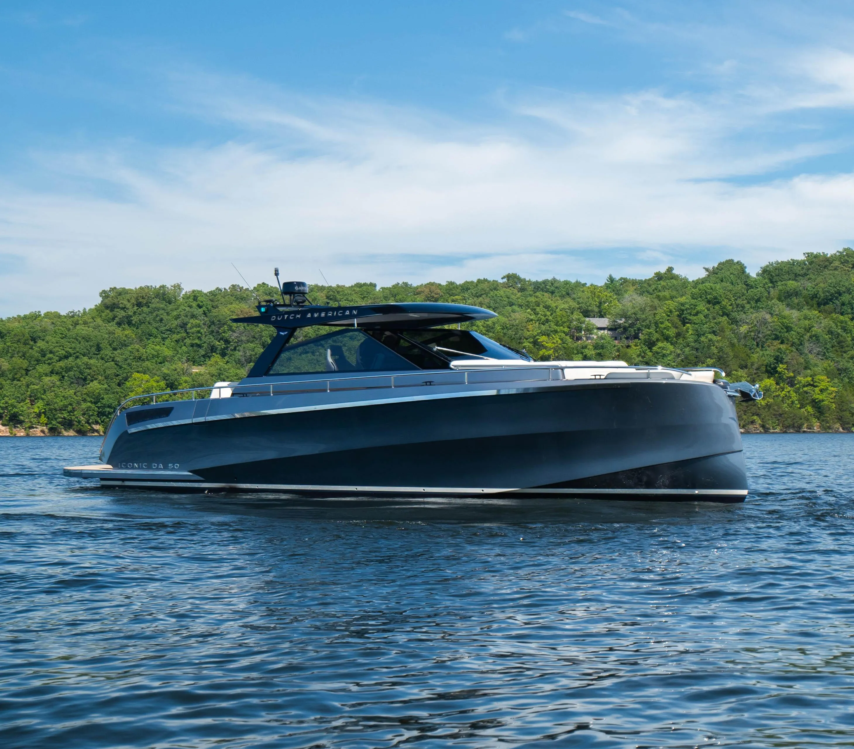 2024 Dutch American Iconic DA 50 yacht on a serene lake under blue skies.