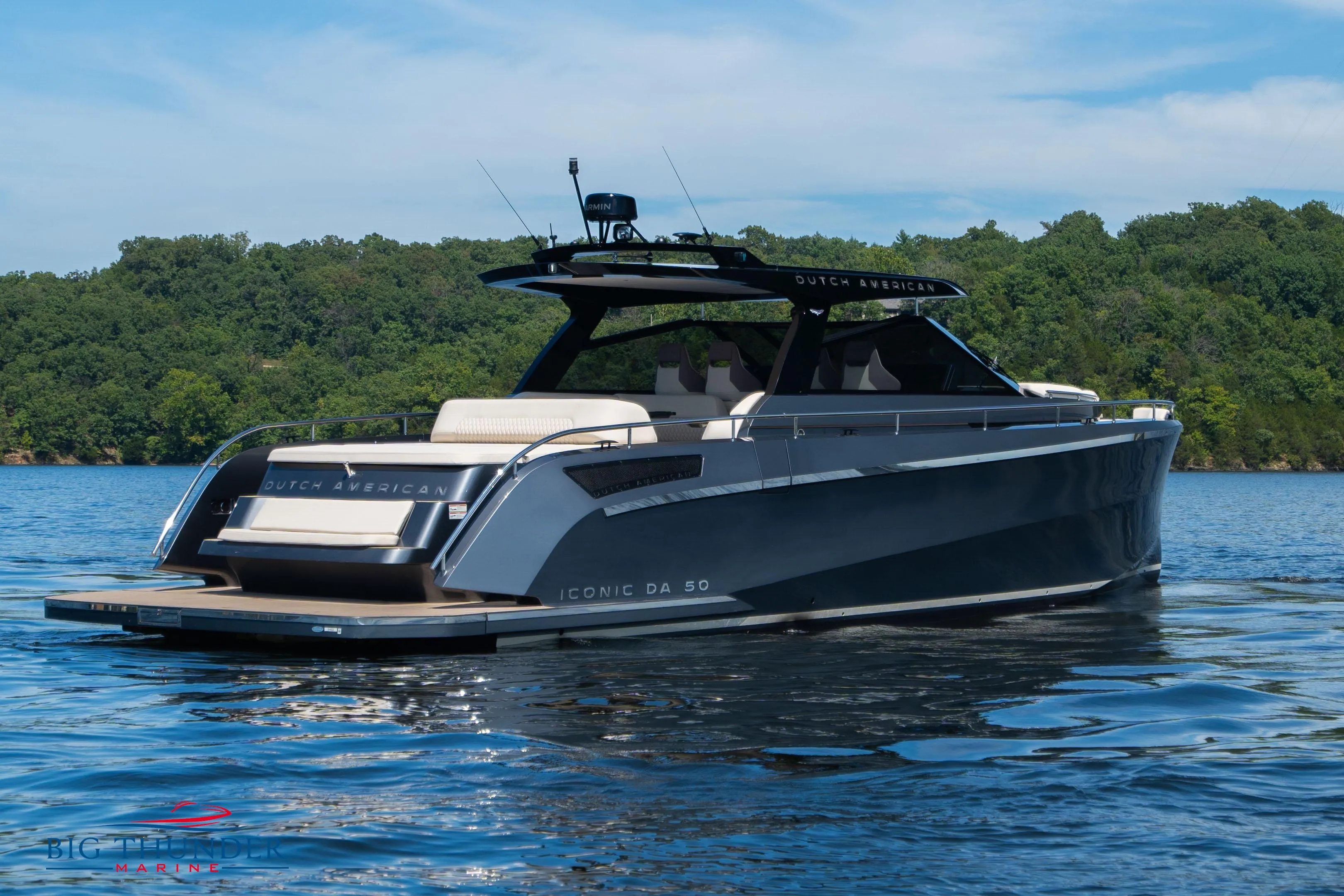 2024 Dutch American Iconic DA 50 yacht on a serene lake.