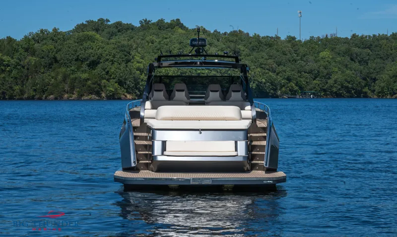  Yacht Photos Pics 2024 Dutch American Iconic DA 50 boat on a serene lake with lush green background.