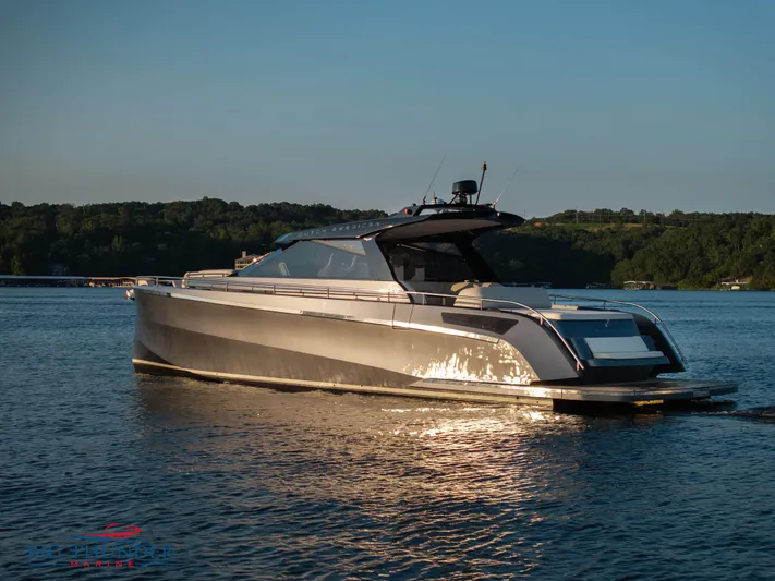 Yacht Photos Pics 2024 Dutch American Iconic DA 50 yacht on serene water at sunset.