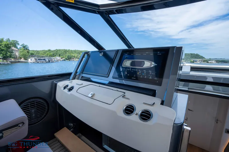  Yacht Photos Pics 2024 Dutch American Iconic DA 50 yacht dashboard with dual screens, lake view.