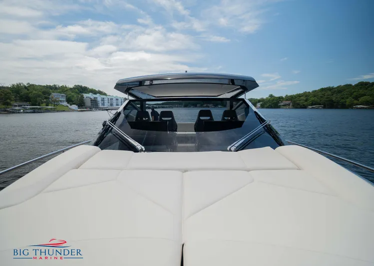  Yacht Photos Pics 2024 Dutch American Iconic DA 50 yacht on serene lake with lush green shoreline.