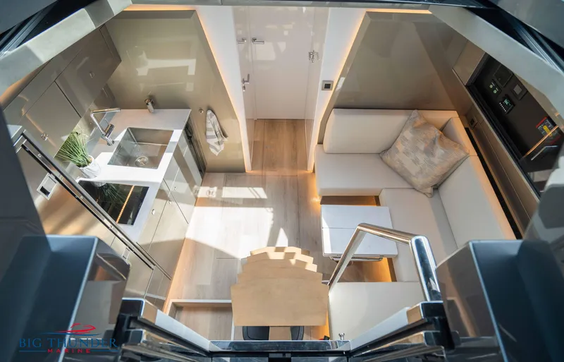  Yacht Photos Pics Luxurious interior of 2024 Dutch American Iconic DA 50 yacht, featuring modern kitchen and seating area.