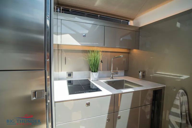  Yacht Photos Pics Modern kitchen in 2024 Dutch American Iconic DA 50 yacht, featuring sleek cabinetry and appliances.