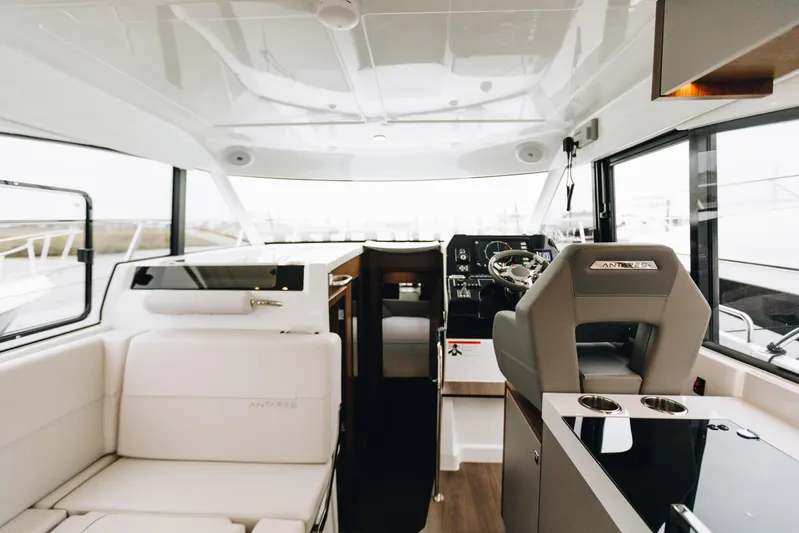  Yacht Photos Pics Interior of 2026 Beneteau Antares 11 Fly, featuring modern helm and seating area.